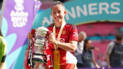 Manchester United's Maya Le Tissier with the trophy after their side’s victory in the Adobe Women's FA Cup final at Wembley Stadium