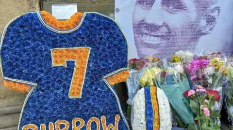 PA Floral tributes to Rob Burrow