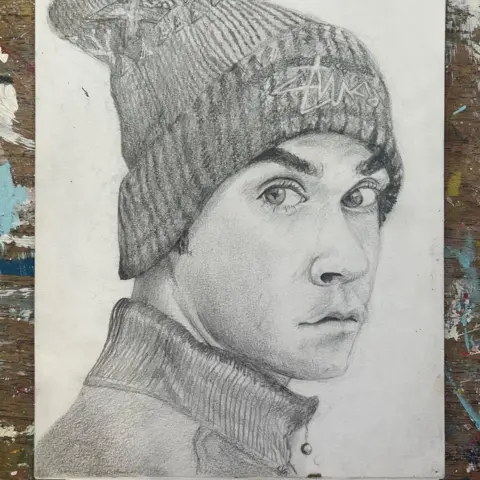 Sarah Graham A pencil portrait of Robbie Williams