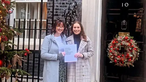 Dr Becky Cox Dr Becky Cox and Dr Chelcie Jewitt outside 10 Downing Street