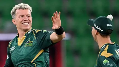 Peter Siddle catches the ball from a team-mate as he prepares to bowl for Multan Sultans in a Pakistan Super League game