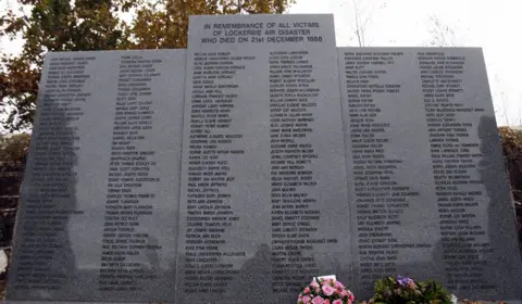 Getty Images Grey memorial stone listing the names of everyone who died in the Lockerbie bombing