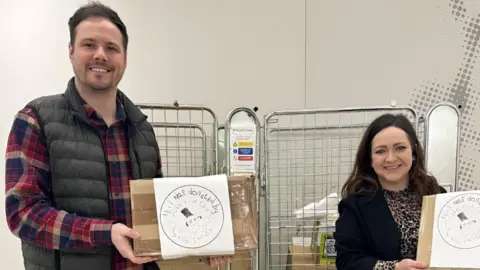 Mellon-Jameson family handout/PA Arron and Lucy Mellon-Jameson donate books to Sheffield Children's Hospital