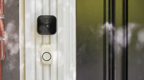 A video doorbell on a house.