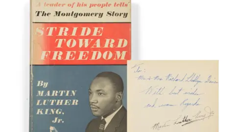 Oxfam The book has a red white and blue cover with an image of King in black and white. Next to it is the inscription written by him, reading: "To Mr & Mrs Richard Llewellyn Davies, with best wishes and warm regards Martin Luther King Jr."