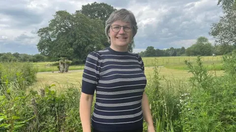 Candidate for South West Norfolk for the Lib Dems Josie Radcliffe standing in beautiful Norfolk countryside 
