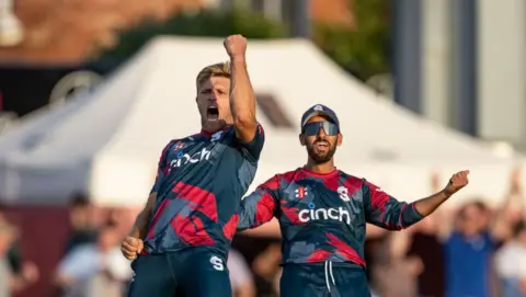 Getty Images David Willey of Northamptonshire Steelbacks (left) celebrates with his team mate Saif Zaib after taking the wicket of Dan Mouseley of Birmingham Bears during the T20 Vitality Blast match between Northamptonshire Steelbacks and Birmingham Bears at The County Ground on 18 July.