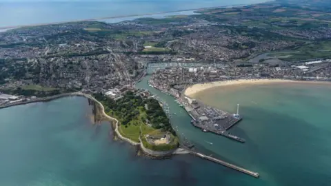 Dorset Council An aerial view of Weymouth with the sea in the foreground 