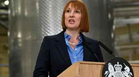 Getty Images Chancellor Rachel Reeves, giving a speech at a lecturn