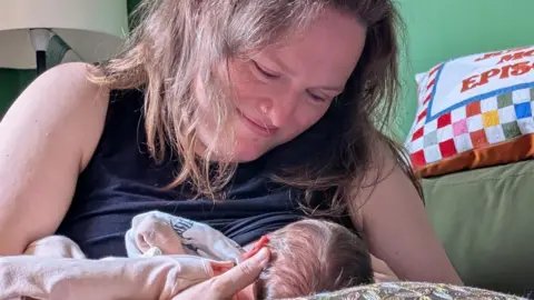 Lucy's family Lucy breastfeeding her newborn baby
