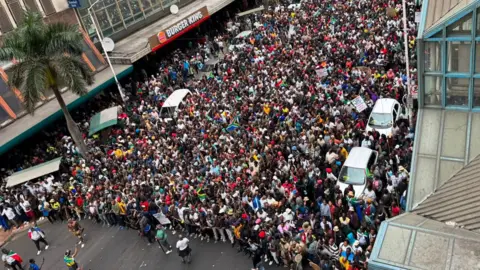 Thuthuka Zondi / BBC Aerial view of the marchers in Durban