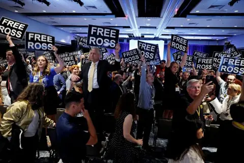 Chip Somodevilla/Getty Images  Members of the Libertarian Party stand in chairs at the Libertarian National Convention