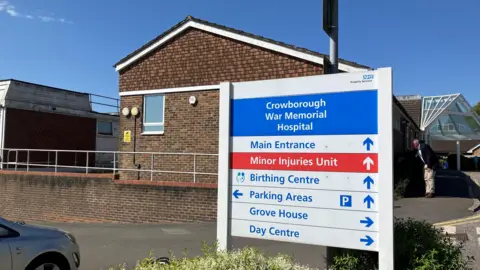 Sam Dixon-French/BBC A sign showing the birthing centre and other services at Crowborough War Memorial Hospital