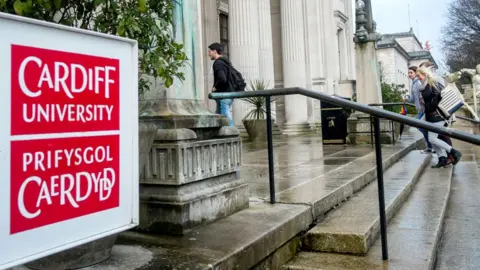 Alamy The exterior of a Cardiff University building with students entering