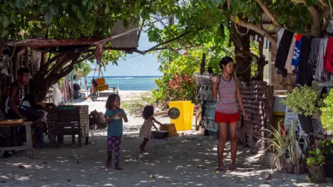 Small children play on the island of Pagasa
