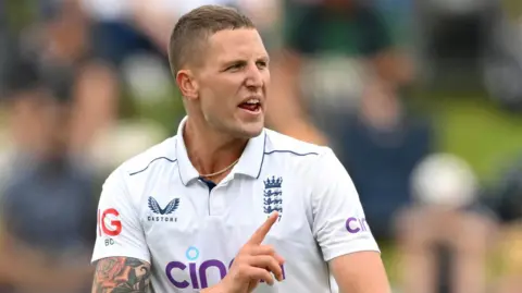 Brydon Carse bowling for England in New Zealand in December