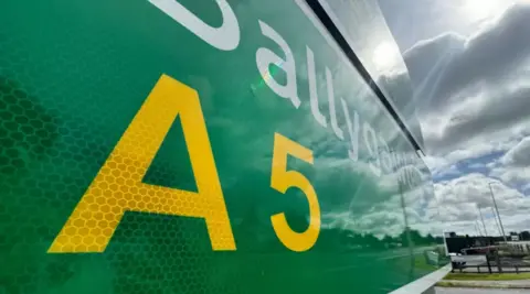 A sign showing the A5 on it - it's green with A5 in yellow and Ballygawley in white 