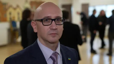John Fairhall/BBC Eduard Fesko, Ukraine Chargé d’Affaires, at Stansted Airport