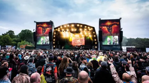 Getty Images A sea of people in front of a festival stage