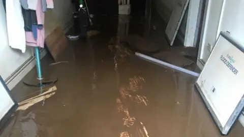 Carole Collier Carole's shop in floodwater