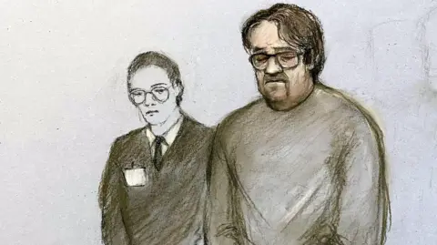 Elizabeth Cook/PA Wire Court artist sketch of surgeon Neil Hopper. He is standing next to a female member of staff and looking down.  