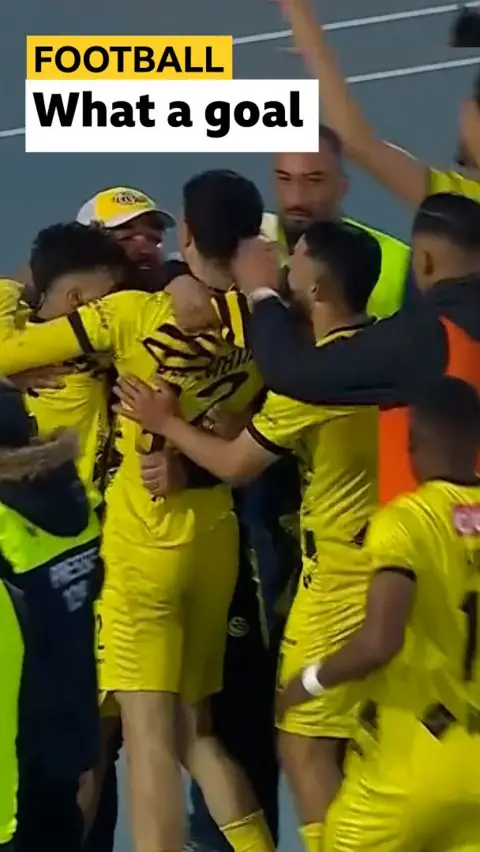 Driss El Jabli celebrates scoring a rabonna goal with his Maghreb Fez teammates