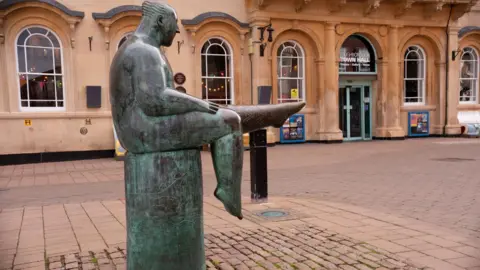 Charnwood Borough Council The Sock Man statue outside Loughborough Town Hall