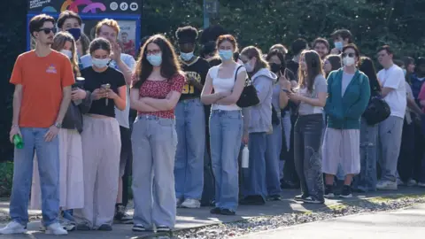 A long queue of people. 