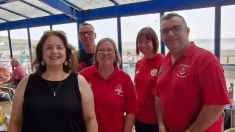 Ruth Jones at Marco's cafe with scouting volunteers