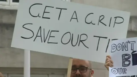 Protestors trying to save local tips