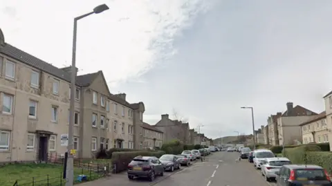 a google view for Lochend Drive with parked cars on both sides of the road outside flats