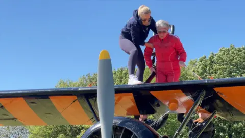 Jenny Thurgut is safely attached to the aeroplane