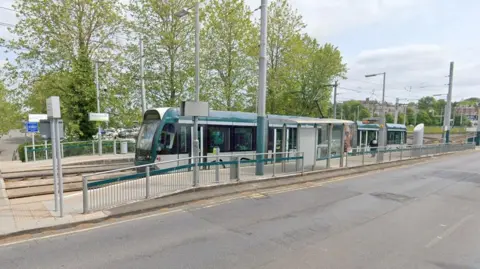 A tram stopped at the Wilkinson Street park and ride stop in Nottingham