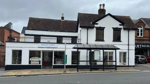 Julia Gregory/ BBC The Horse and Groom has been rebuilt and is now a furniture shop