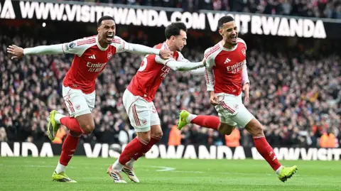 Arsenal players celebrate their goal 