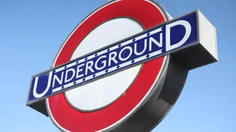EPA/Shutterstock A London Underground sign with a red roundel and the word Underground written in capital letters in white on a blue background