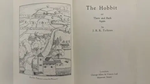 Kinghams Auctioneers The title page of the book and an illustration of a countryside scene 