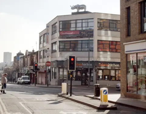 habiloid A giant rhino on top of a building in Birmingham