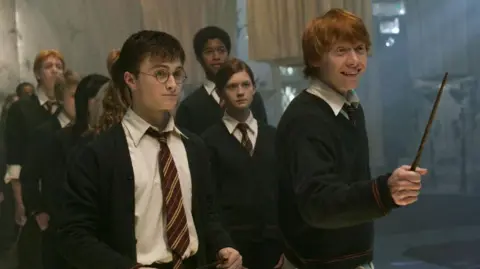 Getty Images Daniel Radcliffe (L) and Rupert Grint (R) on the set of the film, Harry Potter and the Order of the Phoenix, in 2006