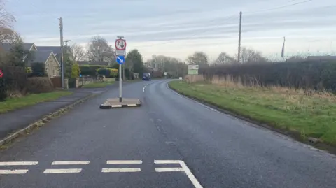 The entrance to Felton village, which has a sign giving way to vehicles coming in the opposite direction.