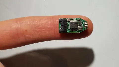 A sensor placed on a persons fingertip.