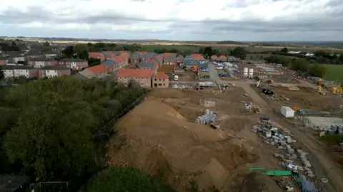 A brown building site, showing the housing estate that is now being built on what was Dinnington Miners Welfare recreation ground