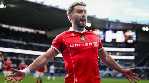 Sam Smith celebrates scoring for Wrexham