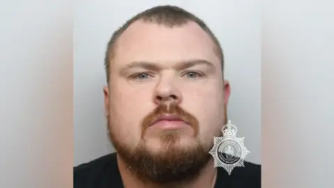 North Wales Police Custody shot of Aaron Evans