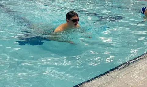 Generic image of swimmer with swimming goggles in a municipal pool