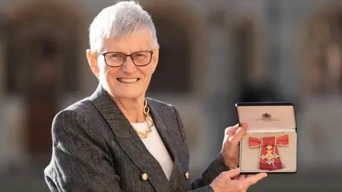 Monica Vaughan after being made an Officer of the Order of the British Empire (OBE) at an investiture ceremony at Windsor Castle, Berkshire.
