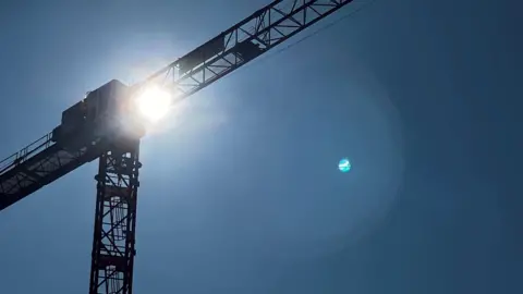 Sunlight coming through a crane.