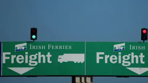 Two green signs directing freight traffic onto Irish Ferries service to Dublin are seen at the Port of Holyhead in Holyhead