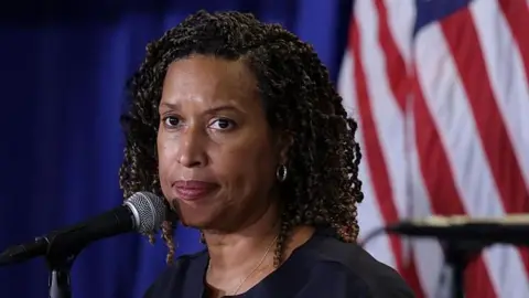 Mayor Muriel Bowser listens during a news conference in August