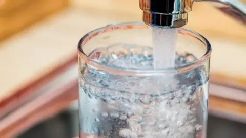 A generic image of glass of water being filled up from a tap